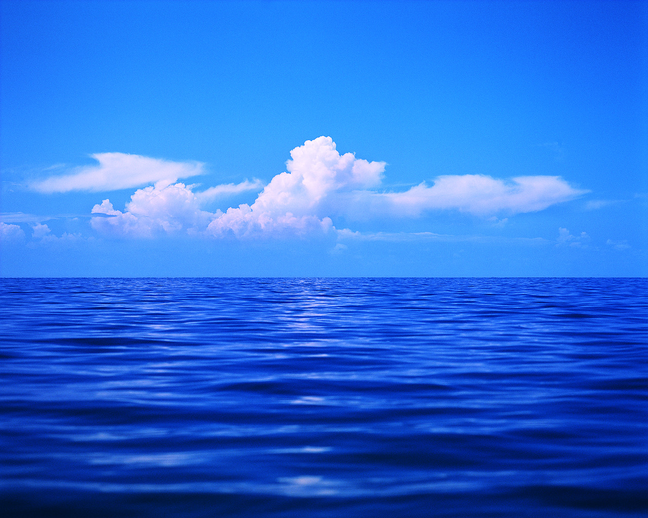 Clouds in a Blue Sky over the Ocean