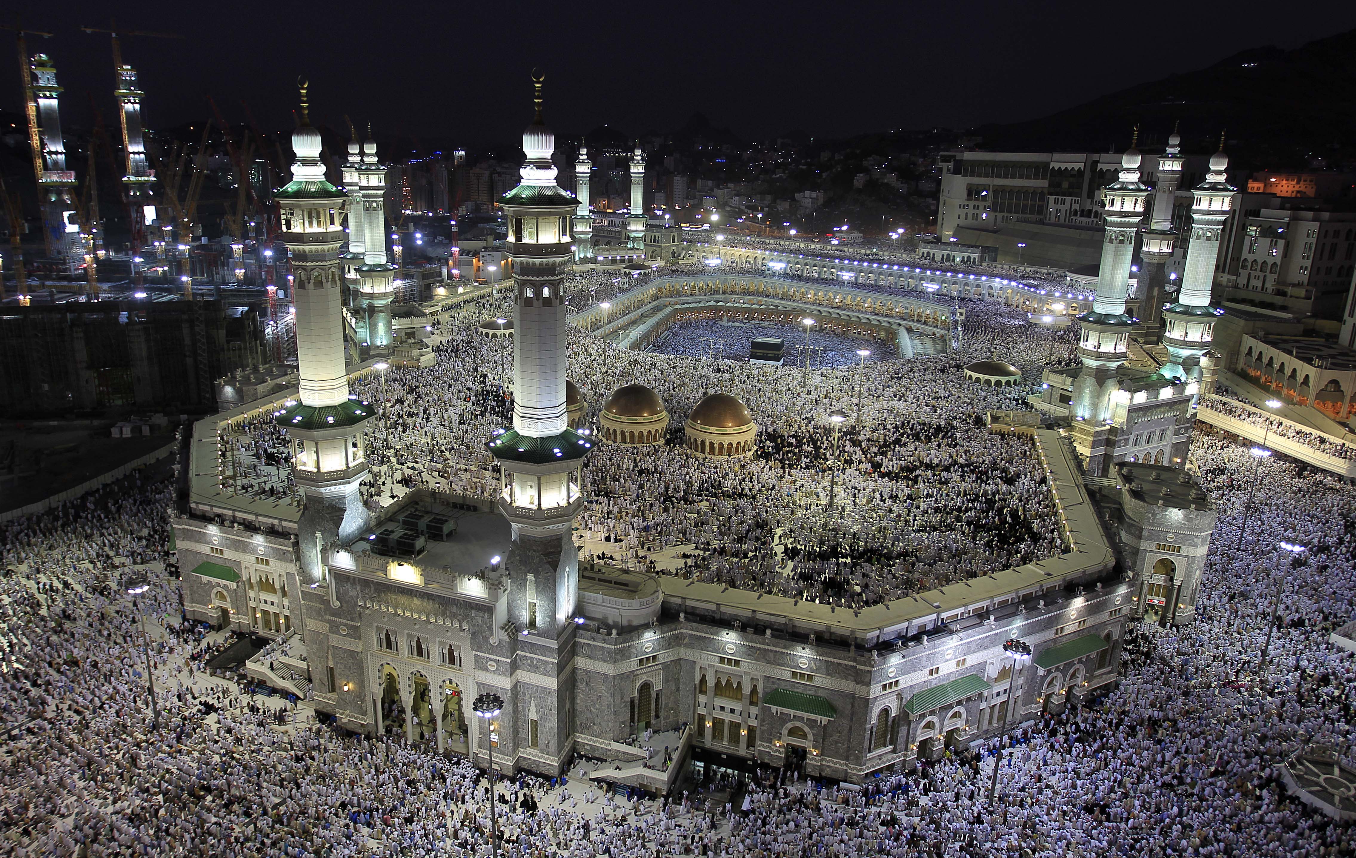 Tens of thousands of Muslim pilgrims move around the Kaaba, seen at center, inside the Grand Mosque, in Mecca, Saudi Arabia, Thursday, Nov. 3, 2011. The annual Islamic pilgrimage draws three million visitors each year, making it the largest yearly gathering of people in the world. The Hajj will begin on November 5. (AP Photo/Hassan Ammar)