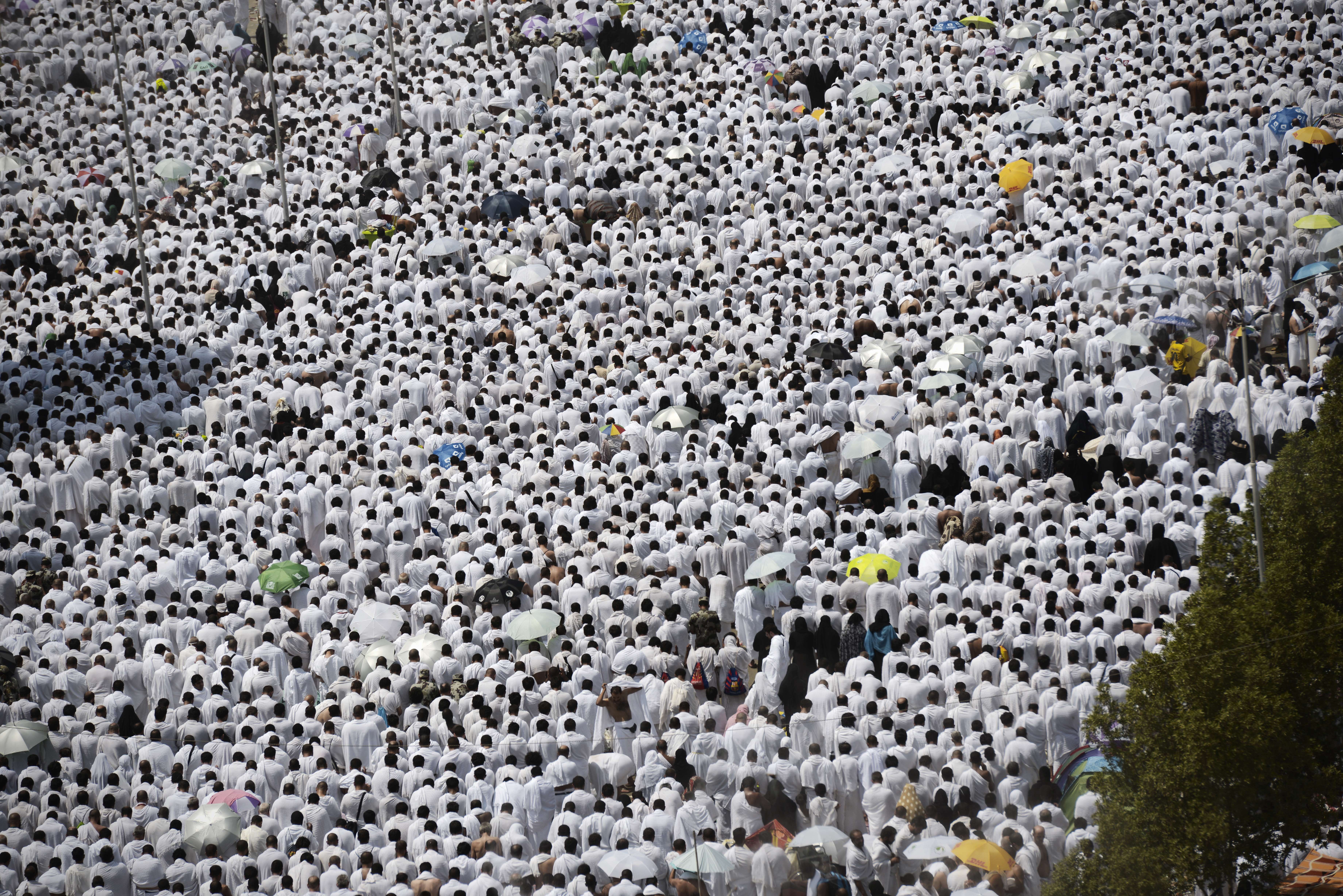 Muslim pilgrims gather to perform noon and afternoon prayers at Namira Mosque in Mount Arafat, southeast of the Saudi holy city of Mecca, on September 23, 2015. Arafat Day, on the 9th of the Islamic month of Dhul Hijja, is the climax of the hajj season. Pilgrims gather on the hill known as Mount Arafat, and its surrounding plain, where they remain until evening for prayer and Koran recitals. Prophet Mohammed is believed to have delivered his final hajj sermon there. AFP PHOTO/MOHAMMED AL-SHAIKH        (Photo credit should read MOHAMMED AL-SHAIKH/AFP/Getty Images)